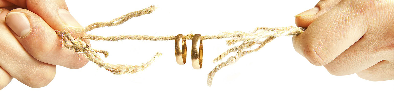 Wedding rings hanging by a rope