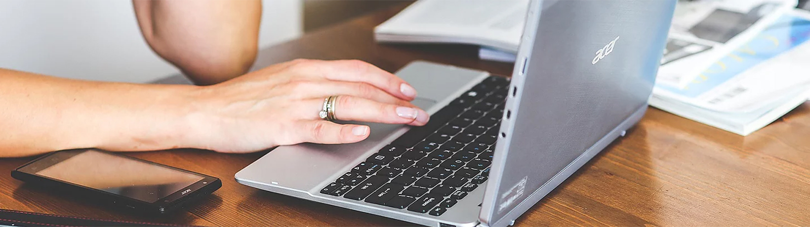 lp-4-b A person is typing on a laptop