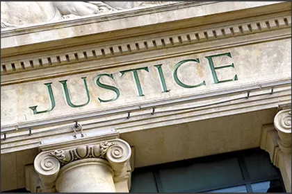 lp-6-1 A close up of the word justice on top of a building.