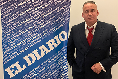 Private investigator Manuel Gomez beside an El Diario poster