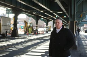 A man wearing a black jacket