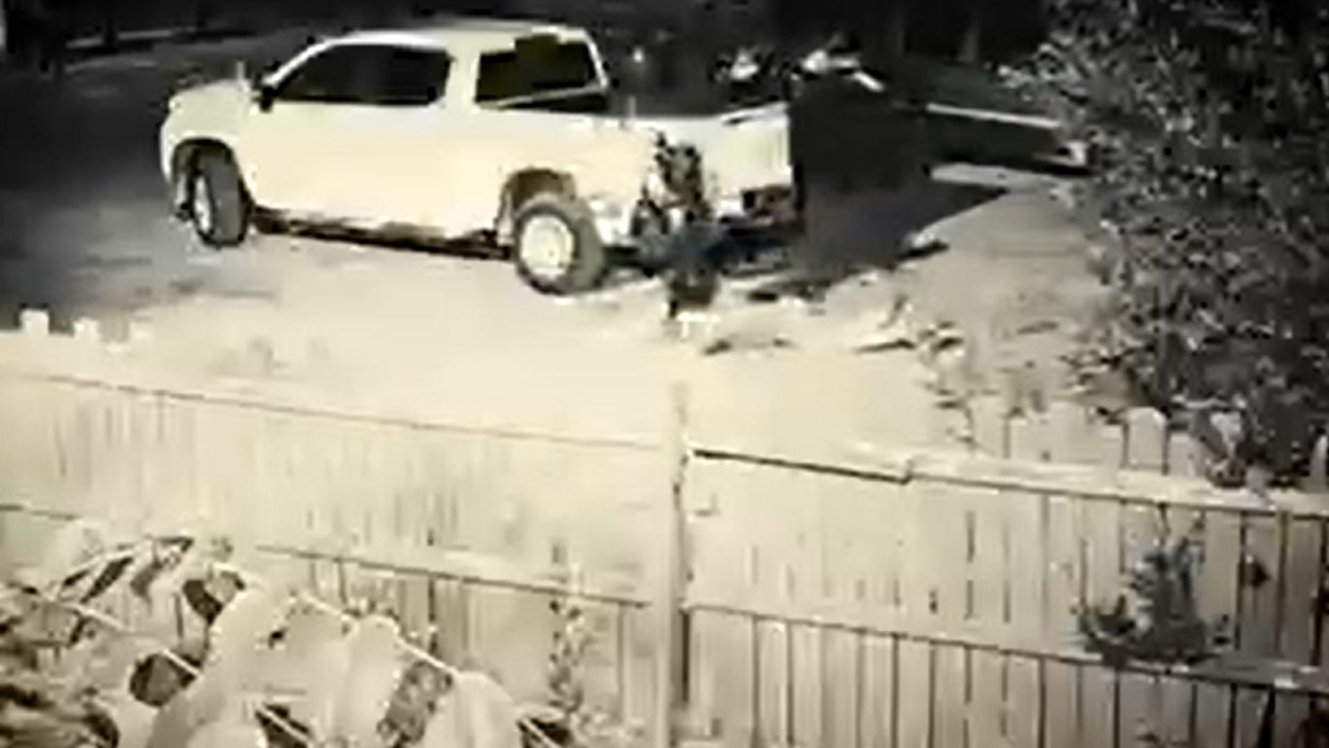 A white truck parked on top of a road.