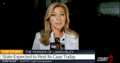 A woman is, talking to the news on tv. A woman is, talking to the news on tv.