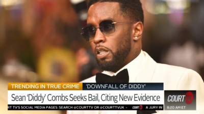 A man in black suit and a bow tie. A man in black suit and a bow tie.