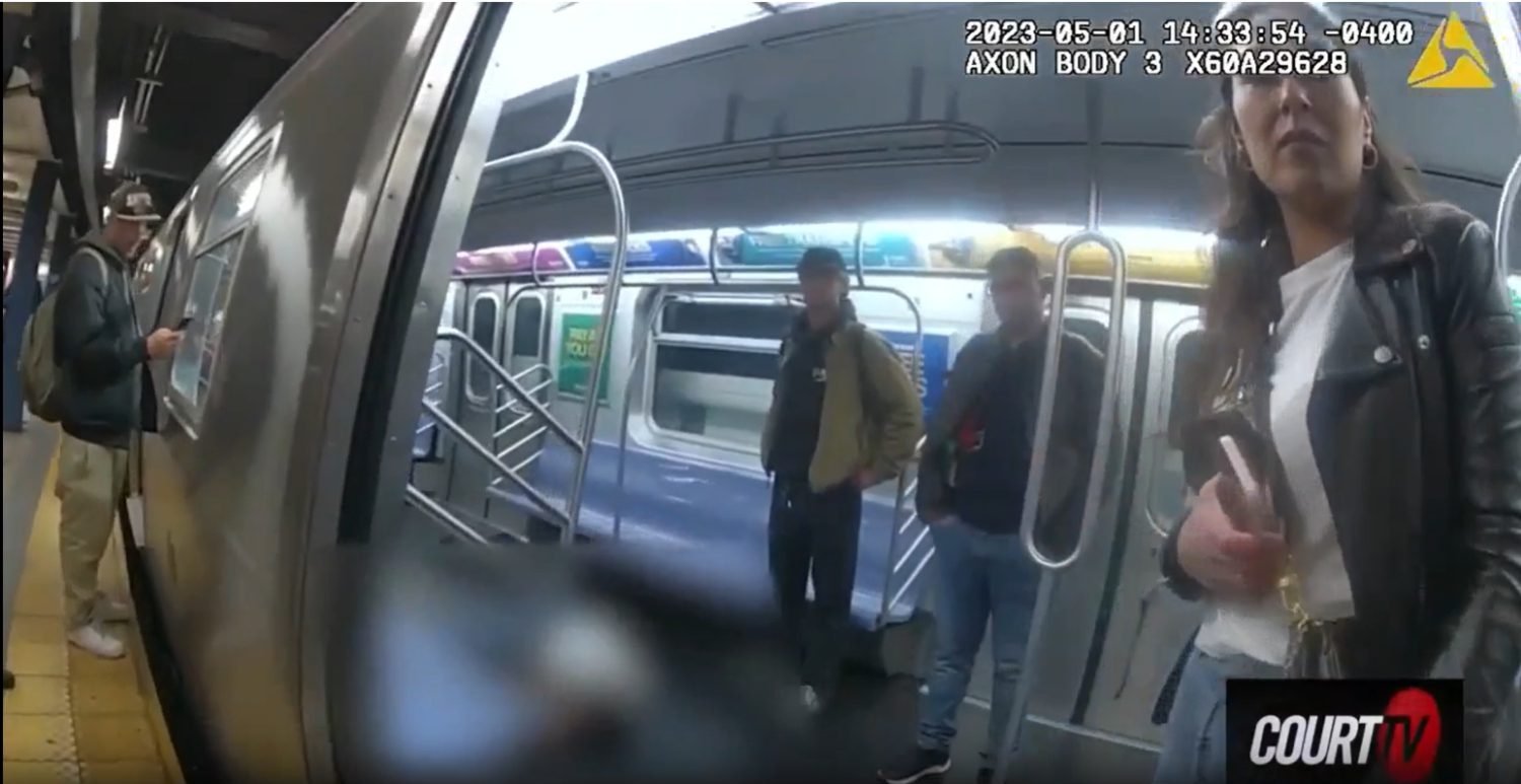 Two men standing on an train platform.