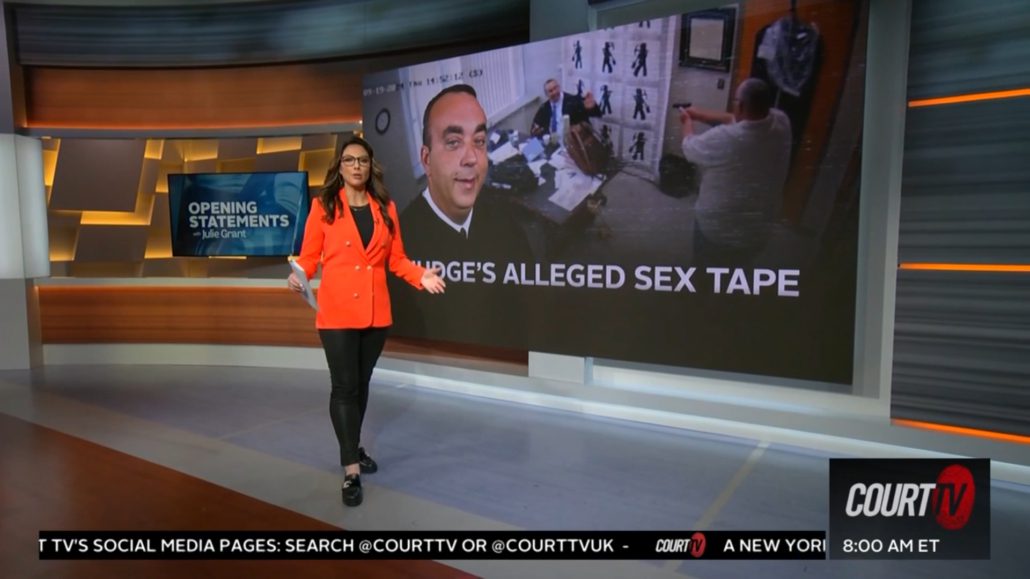 A woman in an orange jacket is, on the news.