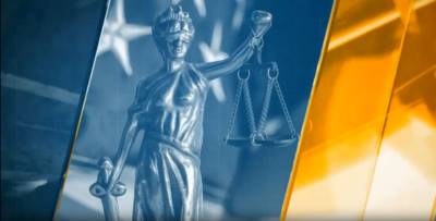 A statue of justice and a the american flag. A statue of justice and a the american flag.